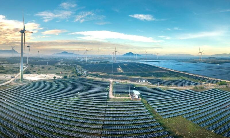 Panoramic aerial shot of a solar and wind farm in Vietnam showcasing renewable energy technologies.